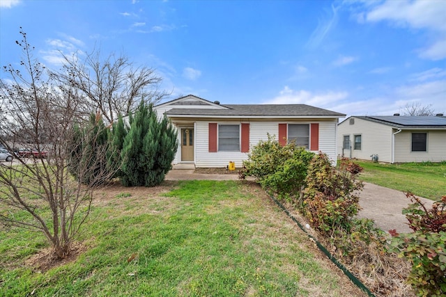 ranch-style house with a front lawn