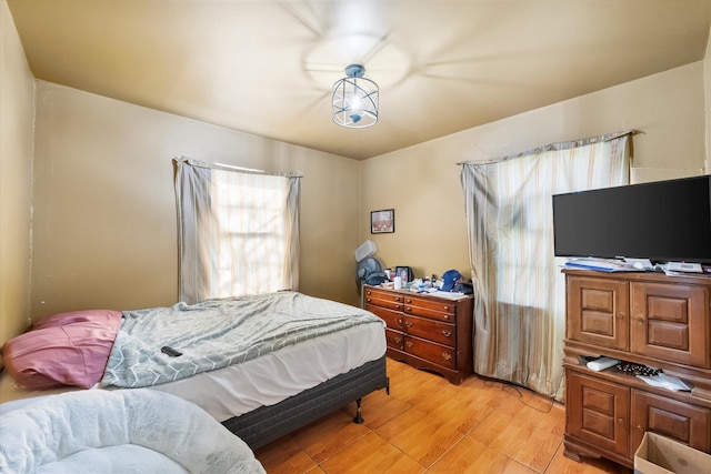 bedroom with light hardwood / wood-style flooring