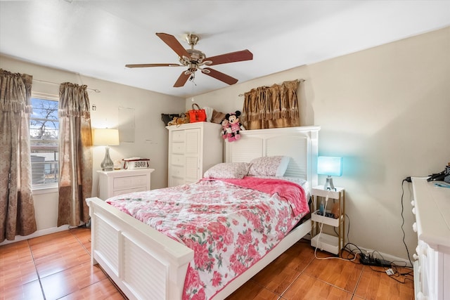 bedroom featuring ceiling fan and hardwood / wood-style floors