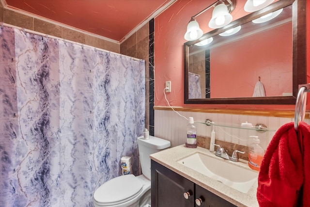 bathroom with vanity, crown molding, curtained shower, and toilet