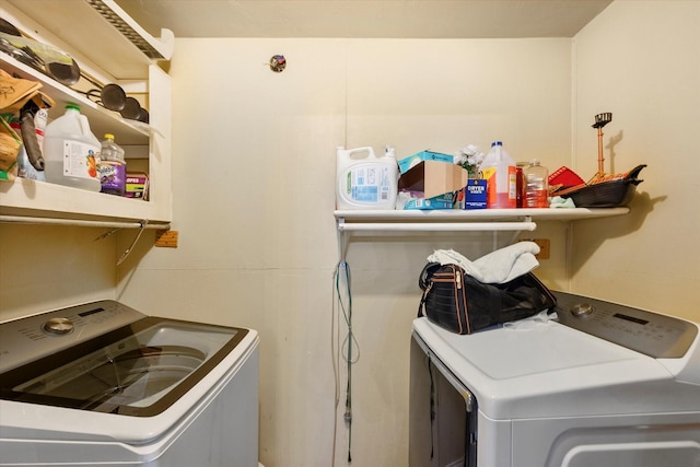 clothes washing area with independent washer and dryer