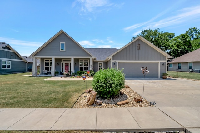 craftsman-style house featuring a garage, central air condition unit, and a front yard