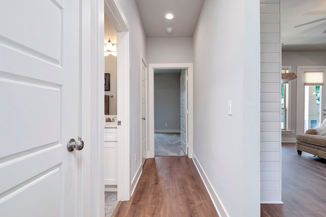 hall with dark hardwood / wood-style floors