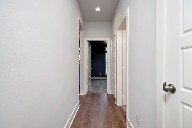 hall featuring dark wood-type flooring