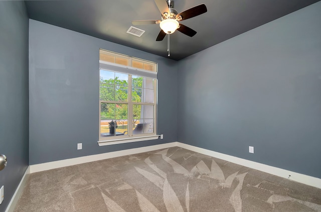 empty room with ceiling fan and carpet flooring