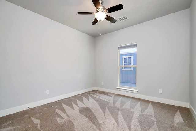 carpeted empty room with ceiling fan