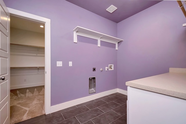 laundry area with washer hookup, electric dryer hookup, and dark tile patterned flooring