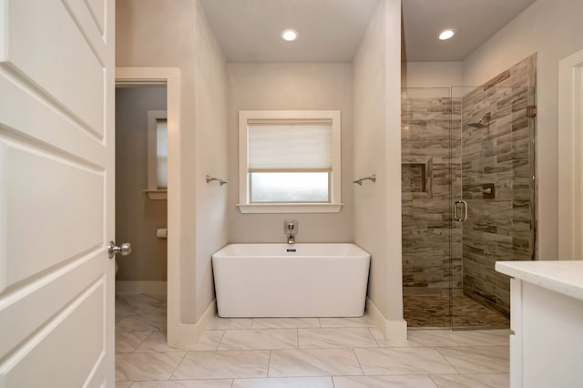 bathroom featuring separate shower and tub and tile patterned flooring