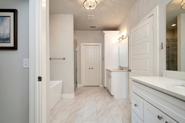 bathroom featuring double vanity, shower with separate bathtub, and tile patterned floors