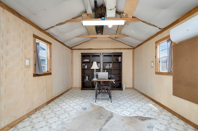 home office with an AC wall unit and vaulted ceiling with beams