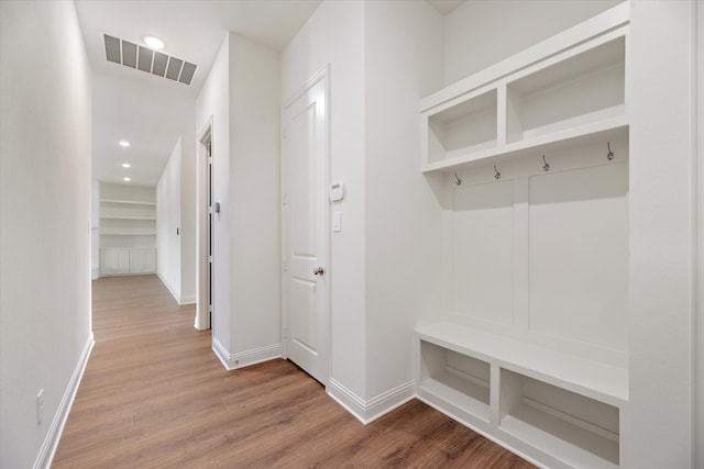 mudroom with hardwood / wood-style floors