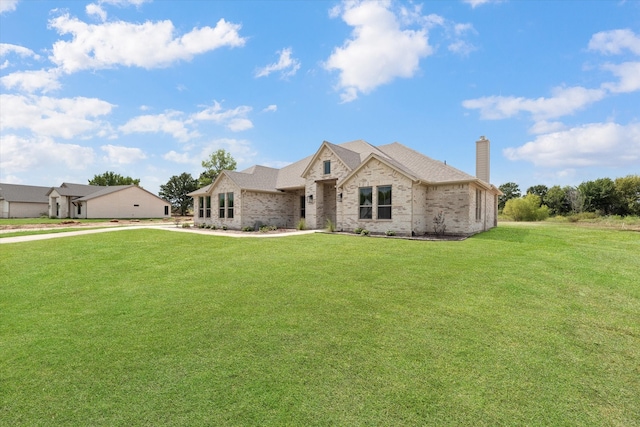 french country home with a front lawn