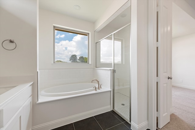 bathroom featuring tile patterned flooring and plus walk in shower