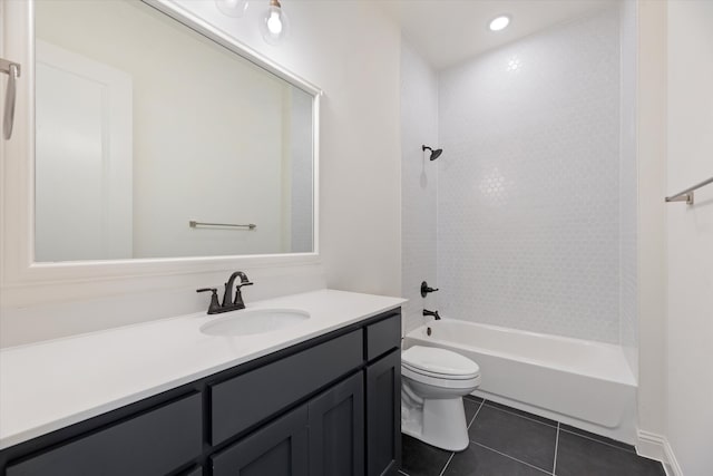 full bathroom featuring vanity, toilet,  shower combination, and tile patterned floors