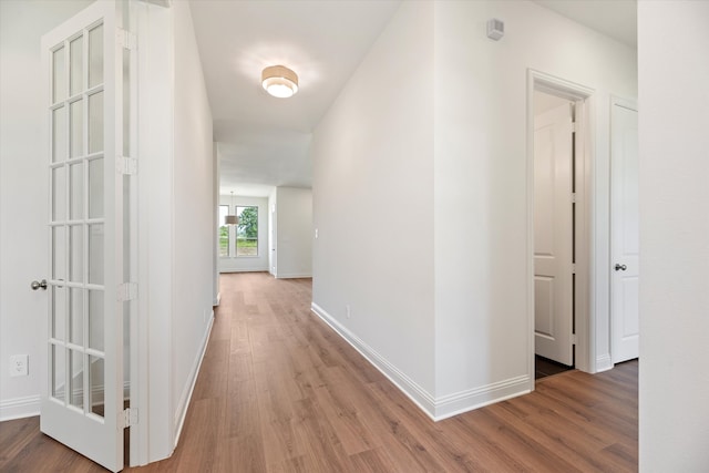 corridor featuring wood-type flooring