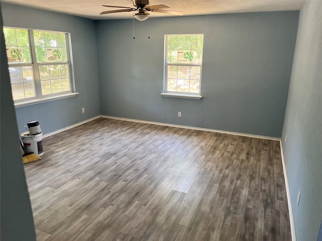 unfurnished room with hardwood / wood-style flooring, a textured ceiling, and ceiling fan