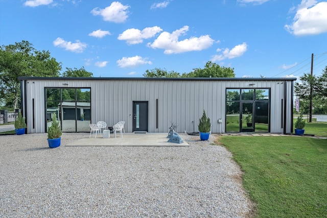 view of outbuilding with a lawn