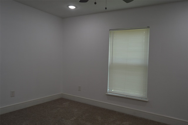 unfurnished room with carpet floors and ceiling fan