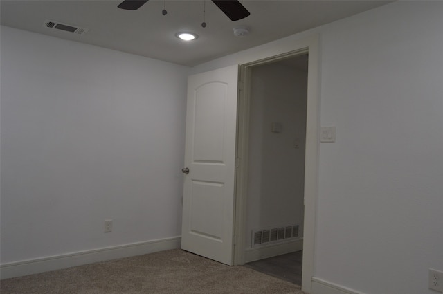 spare room with carpet floors and ceiling fan