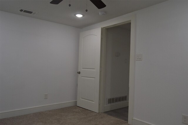 empty room with carpet floors and ceiling fan