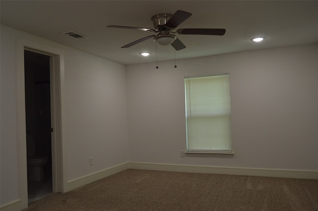 unfurnished room with ceiling fan and carpet flooring