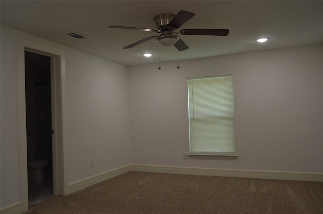 unfurnished room featuring ceiling fan and carpet flooring