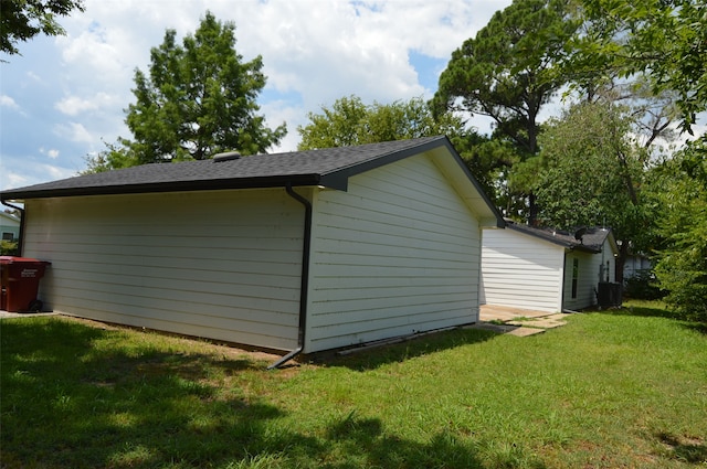 view of outdoor structure with a lawn