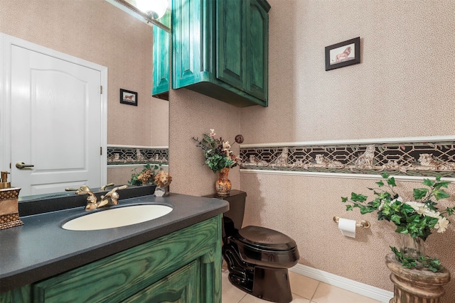 bathroom featuring tile patterned flooring, vanity, and toilet