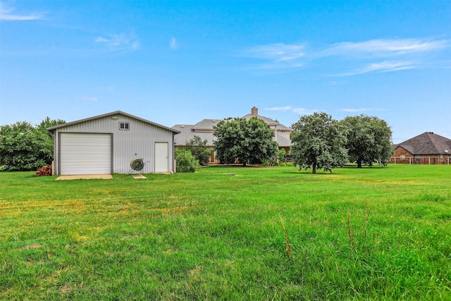 view of yard with an outdoor structure and a garage