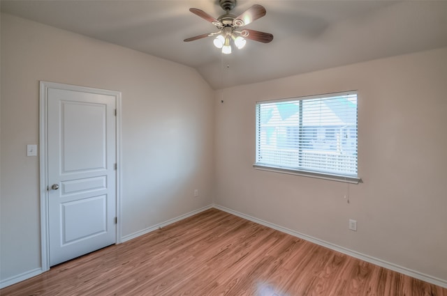 spare room featuring light hardwood / wood-style flooring and ceiling fan