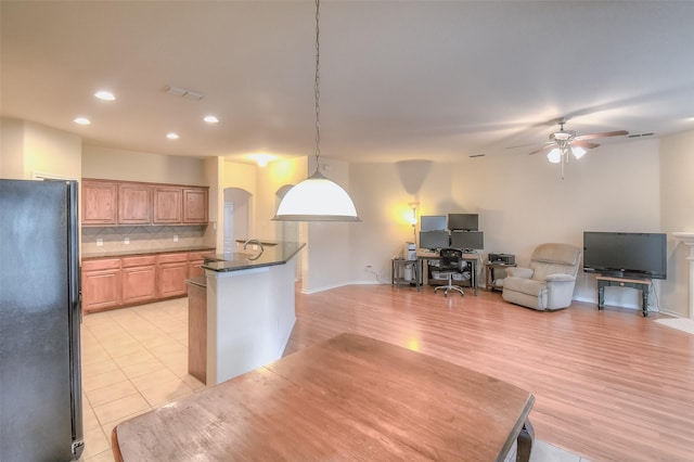 9816 Mullins Crossing Dr, Fort Worth, TX 76126 - kitchen with freestanding refrigerator, ceiling fan, recessed lighting, backsplash, and open floor plan