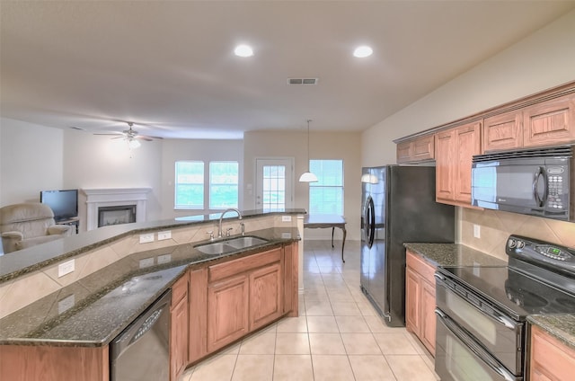 9816 Mullins Crossing Dr, Fort Worth, TX 76126 - kitchen featuring black appliances, a sink, a ceiling fan, light tile patterned floors, and open floor plan
