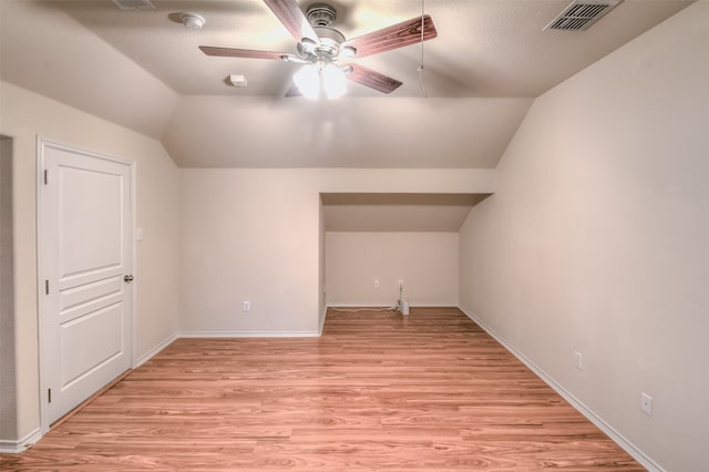 bonus room featuring light hardwood / wood-style flooring, ceiling fan, and vaulted ceiling