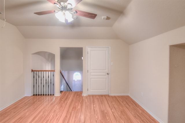 additional living space featuring lofted ceiling, light wood-type flooring, and ceiling fan