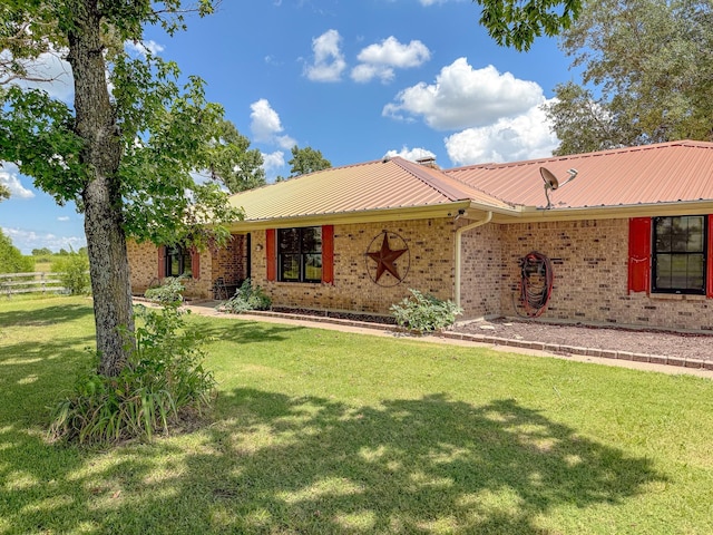 ranch-style house with a front yard