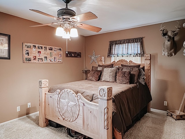 bedroom featuring ceiling fan and carpet