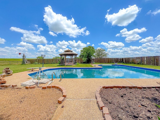 view of pool with a gazebo, a yard, and a patio