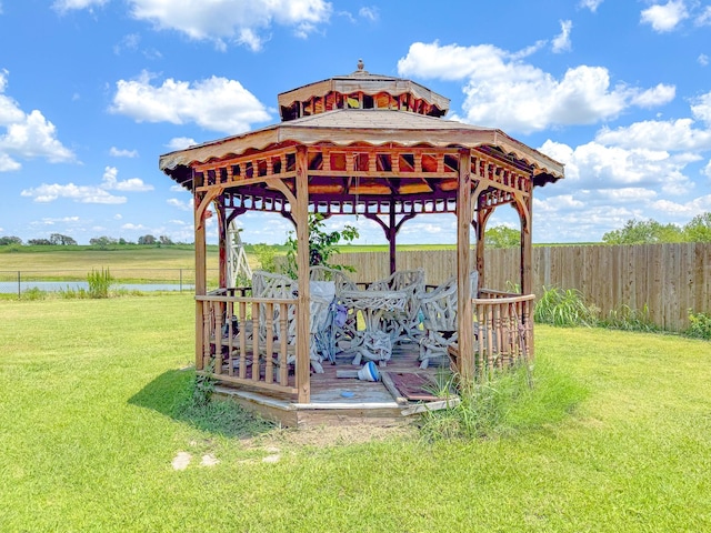 exterior space with a gazebo and a water view