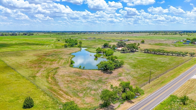 drone / aerial view featuring a water view and a rural view