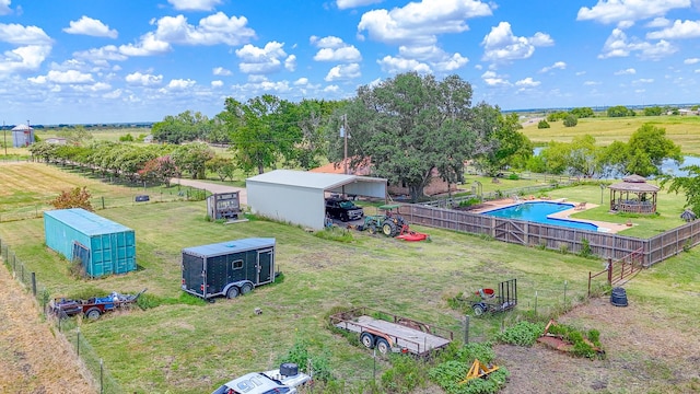 birds eye view of property with a rural view