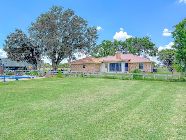 view of yard with a fenced in pool