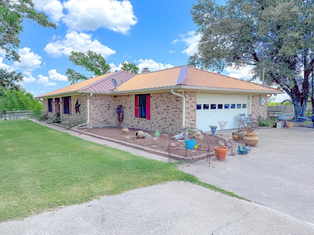 ranch-style home with a front lawn and a garage