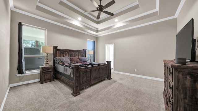 bedroom featuring ornamental molding, light carpet, ceiling fan, and a raised ceiling