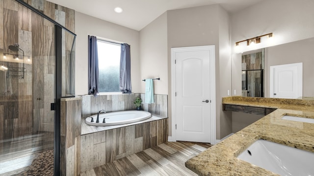 bathroom with plus walk in shower and double vanity