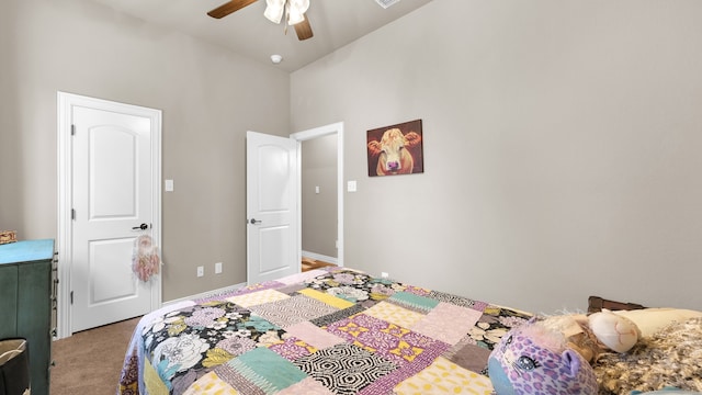 bedroom featuring a high ceiling, carpet, and ceiling fan