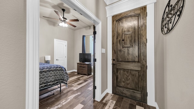 entrance foyer with dark hardwood / wood-style floors and ceiling fan