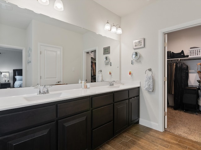 bathroom featuring vanity and hardwood / wood-style flooring