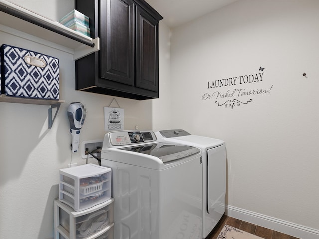 washroom featuring dark hardwood / wood-style flooring, independent washer and dryer, and cabinets