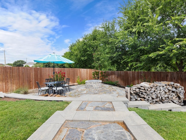 view of patio / terrace with a fire pit