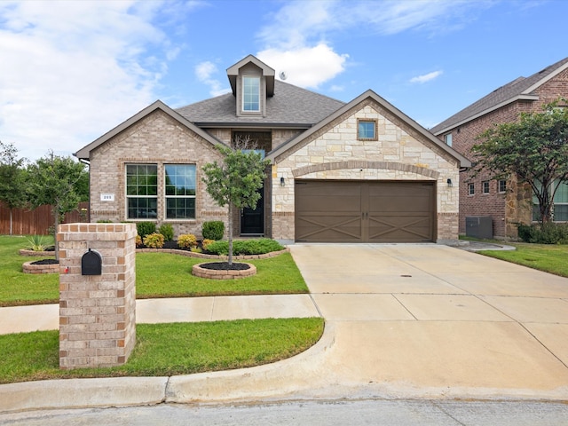 craftsman inspired home with a front lawn and a garage